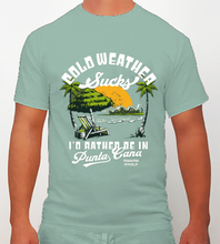 Sage green t-shirt with “Cold Weather Sucks, I’d Rather Be in Punta Cana” and beach scene by Hot Penguin, Ltd.