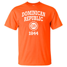 Orange men’s t‑shirt with ‘Dominican Republic 1844’ text and DR seal by Punta Cana T‑Shirts.