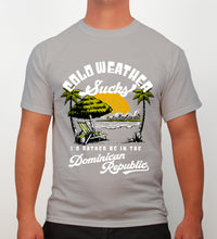 Grey men’s t-shirt with ‘Cold Weather Sucks’ beach graphic and Dominican Republic text by Hot Penguin, Ltd.