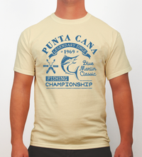Vanilla t-shirt with blue text ‘Punta Cana Fishing Championship Blue Marlin Classic’ by Hot Penguin, Ltd. on a plain background