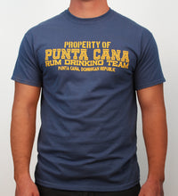 Indigo t-shirt with “Property of Punta Cana Rum Drinking Team” in yellow print by Hot Penguin, Ltd.
